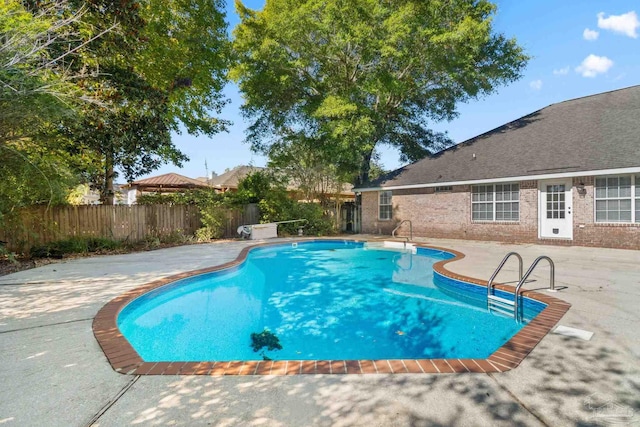 view of swimming pool featuring a patio