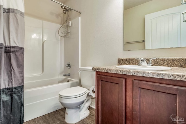 full bathroom featuring hardwood / wood-style flooring, vanity, toilet, and shower / bath combo with shower curtain