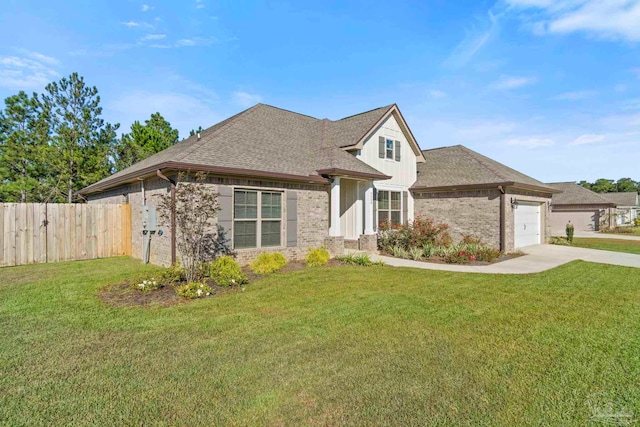 view of front of house featuring a front yard and a garage