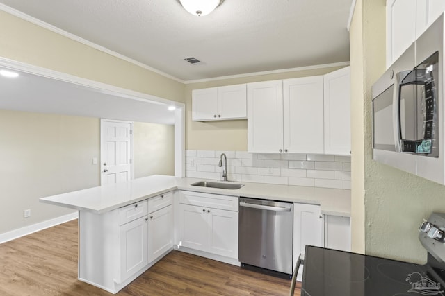 kitchen featuring white cabinetry, sink, and stainless steel appliances