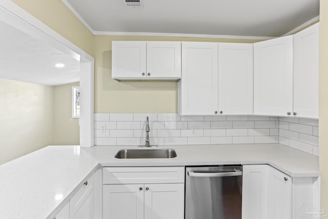 kitchen with white cabinetry, stainless steel dishwasher, and sink