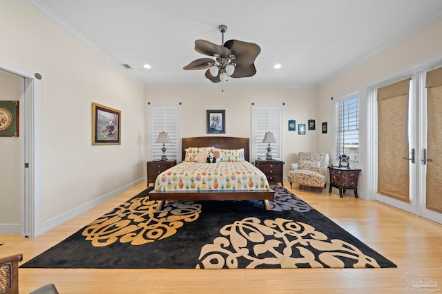 bedroom featuring ceiling fan, light hardwood / wood-style floors, and crown molding