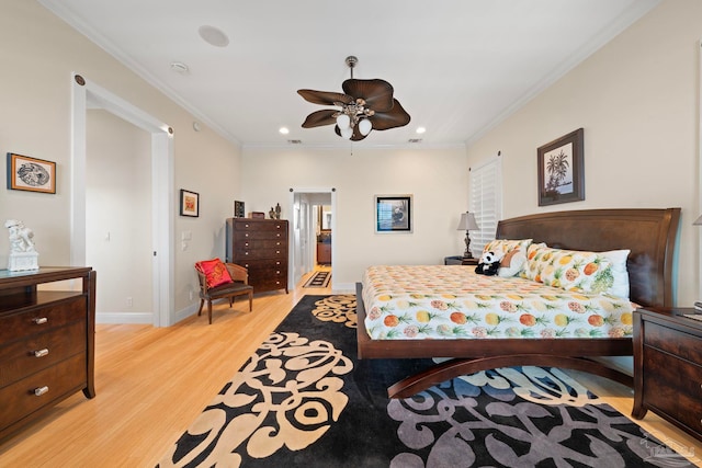 bedroom featuring light hardwood / wood-style flooring, ceiling fan, and ornamental molding