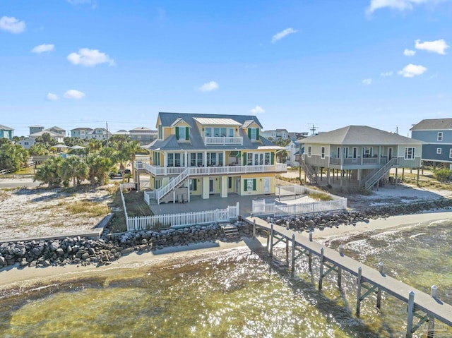 rear view of house with a balcony and a deck