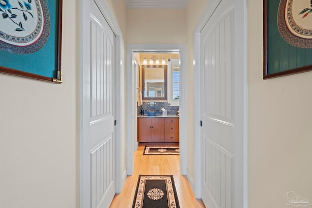 hall with light hardwood / wood-style floors