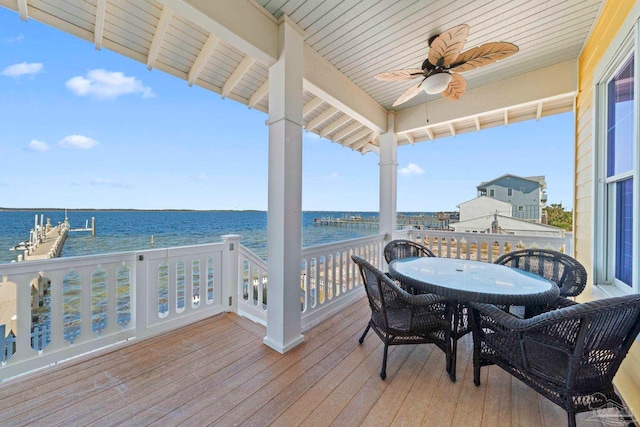 wooden terrace with ceiling fan and a water view