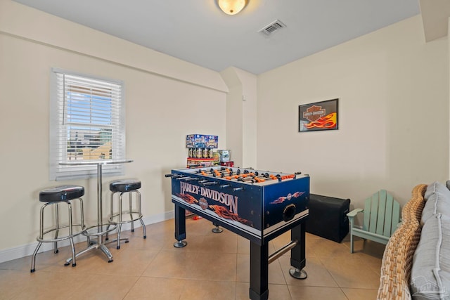 recreation room featuring light tile patterned floors