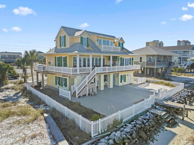 back of house with a balcony