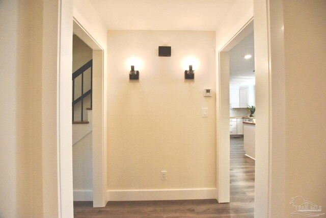 hall with dark wood-type flooring