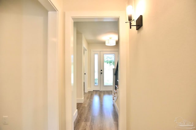 corridor with hardwood / wood-style floors