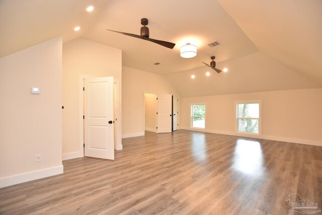 interior space featuring lofted ceiling, ceiling fan, and hardwood / wood-style flooring