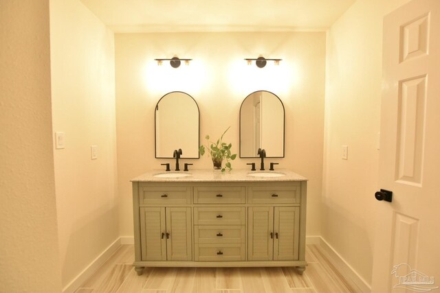 bathroom featuring hardwood / wood-style flooring and vanity