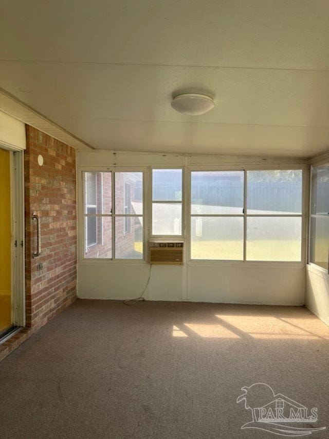 unfurnished sunroom with cooling unit