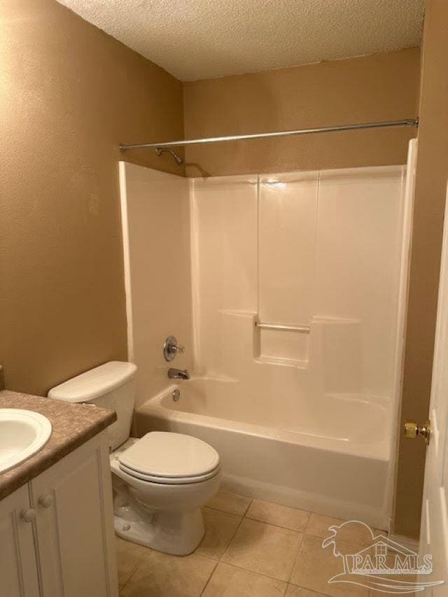 full bathroom featuring shower / bath combination, toilet, tile patterned flooring, a textured ceiling, and vanity