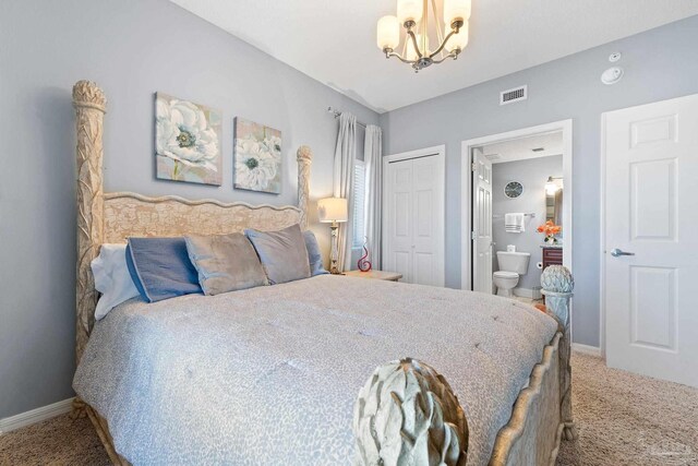 carpeted bedroom with a chandelier