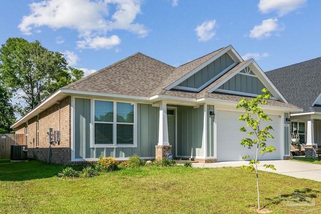 view of front of property with central AC unit and a front lawn