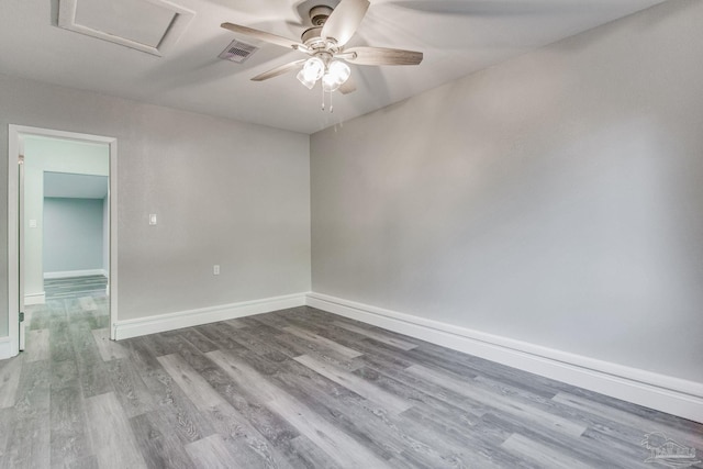 unfurnished room with hardwood / wood-style floors and ceiling fan