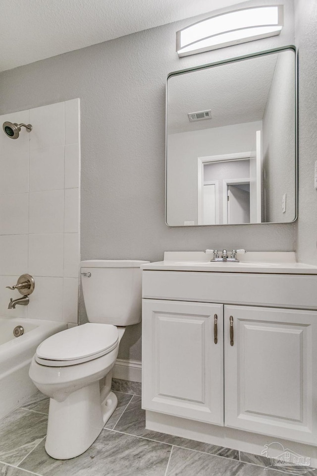 full bathroom featuring vanity,  shower combination, toilet, and tile patterned flooring