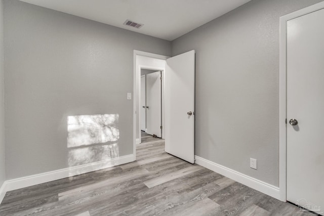 unfurnished bedroom featuring light hardwood / wood-style floors