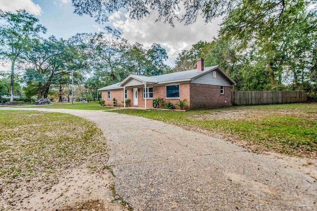 ranch-style house with a front yard