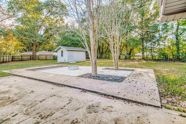 view of yard featuring a patio area and a shed