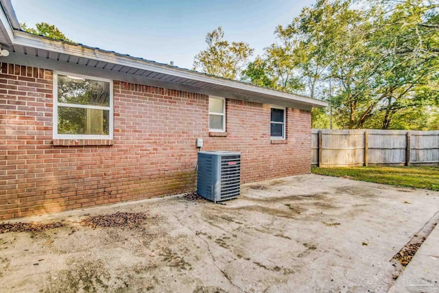 exterior space with central air condition unit and a patio