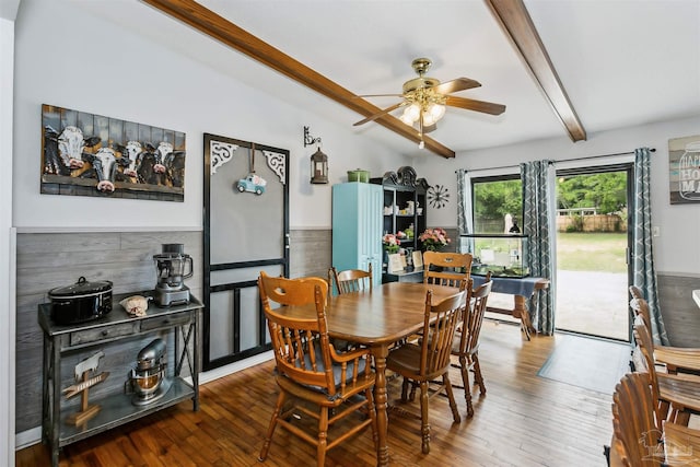 dining space featuring ceiling fan, wainscoting, beam ceiling, and hardwood / wood-style flooring