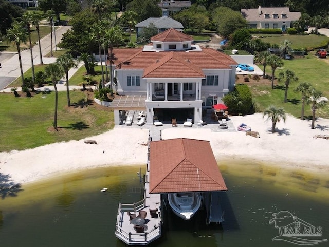 exterior space featuring a water view and boat lift