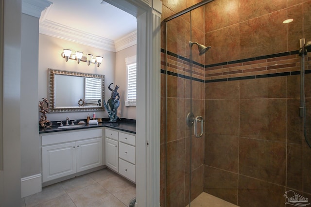 bathroom with a shower with shower door, vanity, crown molding, and tile patterned floors