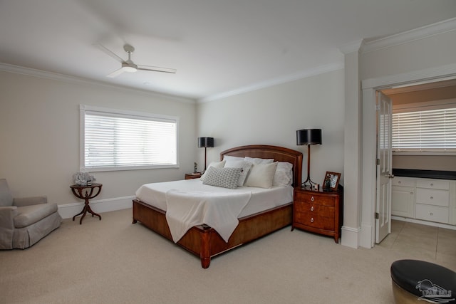 bedroom with ceiling fan, ornamental molding, and light colored carpet