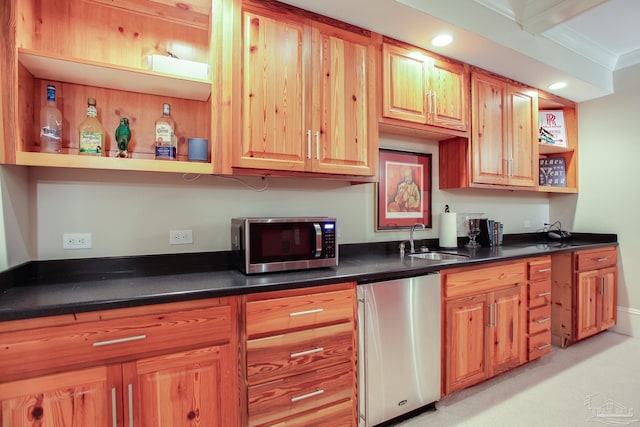 kitchen with refrigerator, open shelves, stainless steel microwave, a sink, and dark countertops