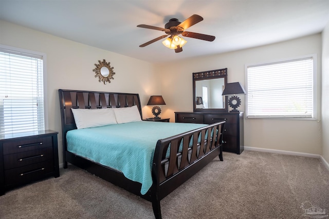 bedroom with light carpet and ceiling fan