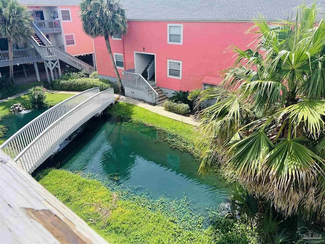 view of pool with a water view