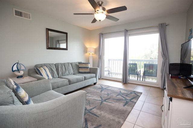 living room featuring ceiling fan and light tile patterned flooring