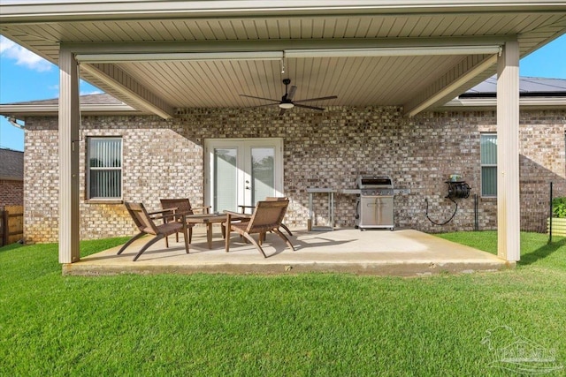 5379 Longhorn Trl, Gulf Breeze, FL 32563 - rear view of house with ceiling fan, a patio area, brick siding, and french doors