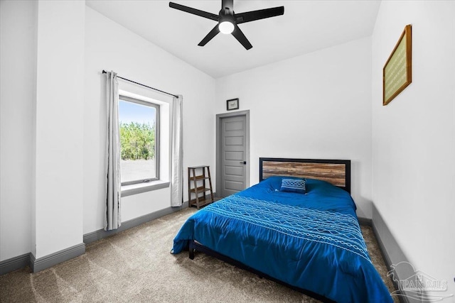 carpeted bedroom featuring ceiling fan and baseboards