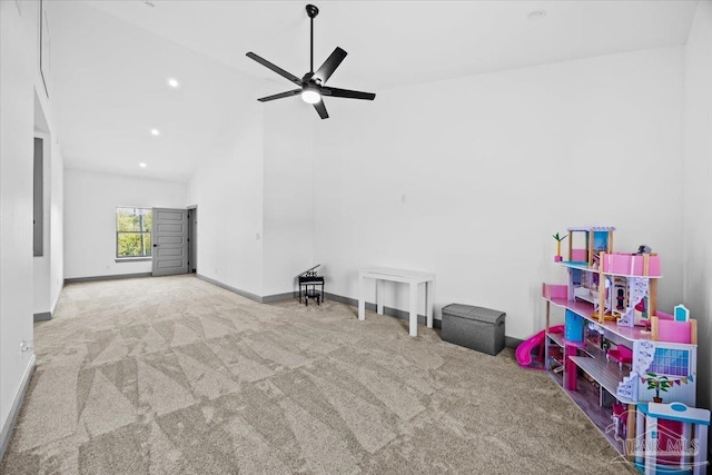 rec room featuring high vaulted ceiling, carpet flooring, baseboards, and a ceiling fan