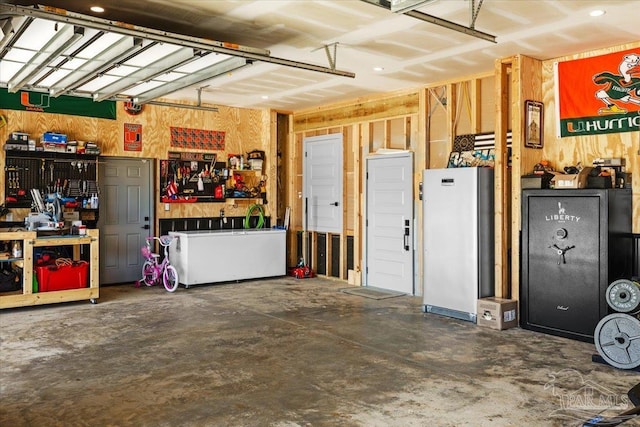 garage featuring a workshop area and a garage door opener