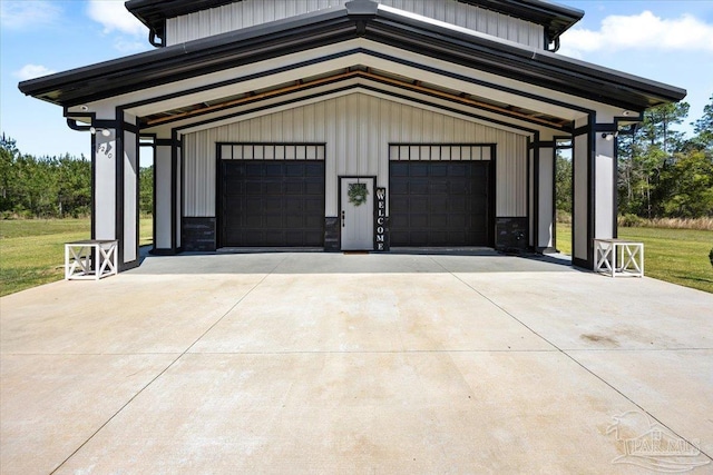 garage with concrete driveway