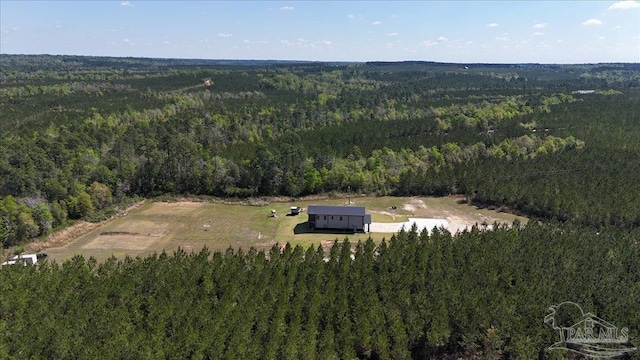 drone / aerial view with a view of trees