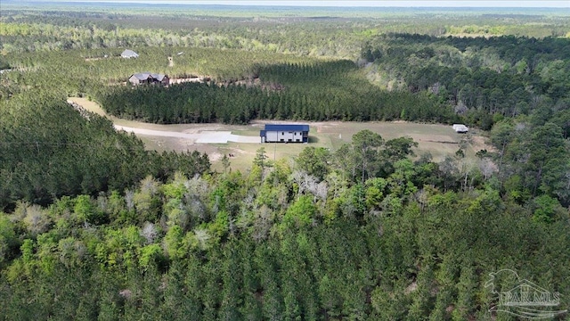 drone / aerial view featuring a view of trees