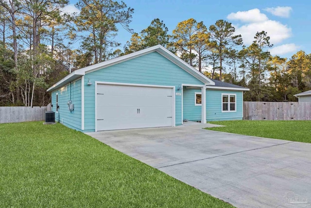 view of front of home with a garage, cooling unit, fence, and a front lawn