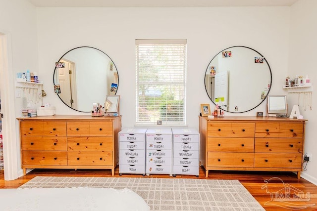 bedroom featuring wood finished floors