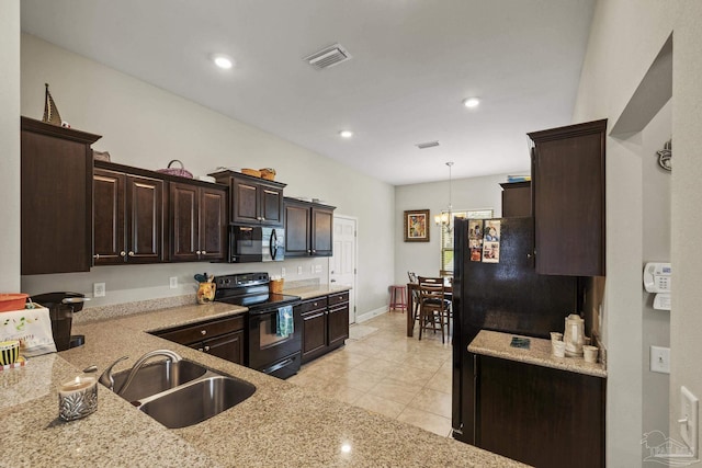 5798 Vendome Ct, Milton, FL 32583 - kitchen featuring a sink, visible vents, light stone countertops, dark brown cabinets, and black appliances