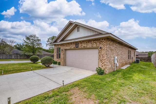 5798 Vendome Ct, Milton, FL 32583 - view of side of property with brick siding, fence, concrete driveway, and a yard