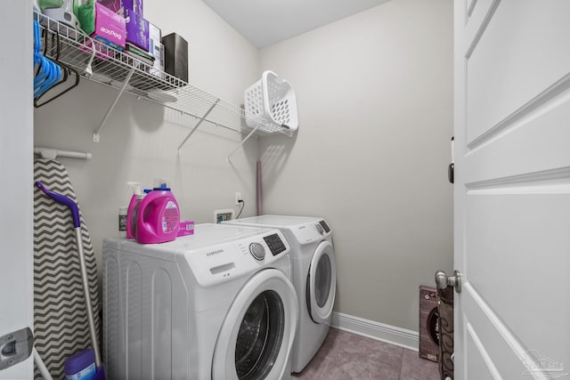 5798 Vendome Ct, Milton, FL 32583 - laundry room with washer and clothes dryer, laundry area, baseboards, and tile patterned floors