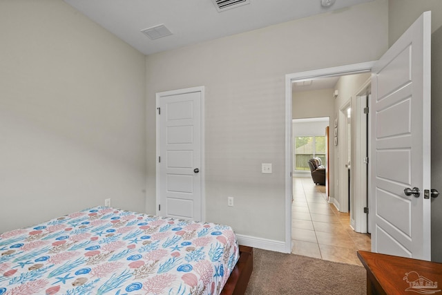 5798 Vendome Ct, Milton, FL 32583 - bedroom with light tile patterned flooring, baseboards, visible vents, and light carpet
