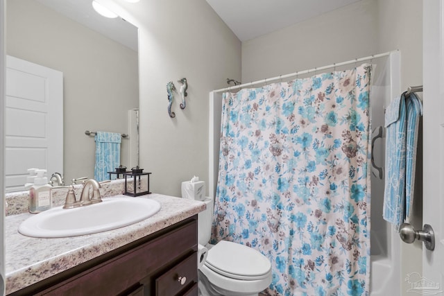 5798 Vendome Ct, Milton, FL 32583 - full bathroom with toilet, vanity, and shower / bath combo with shower curtain