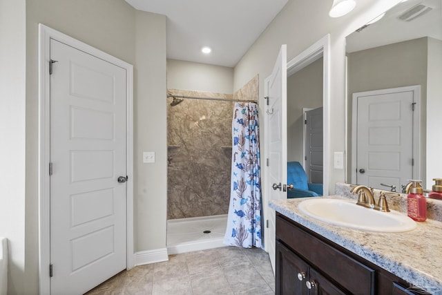 5798 Vendome Ct, Milton, FL 32583 - full bathroom featuring a shower stall, tile patterned floors, visible vents, and vanity