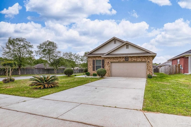 5798 Vendome Ct, Milton, FL 32583 - view of front facade featuring driveway, a front yard, a garage, and brick siding
